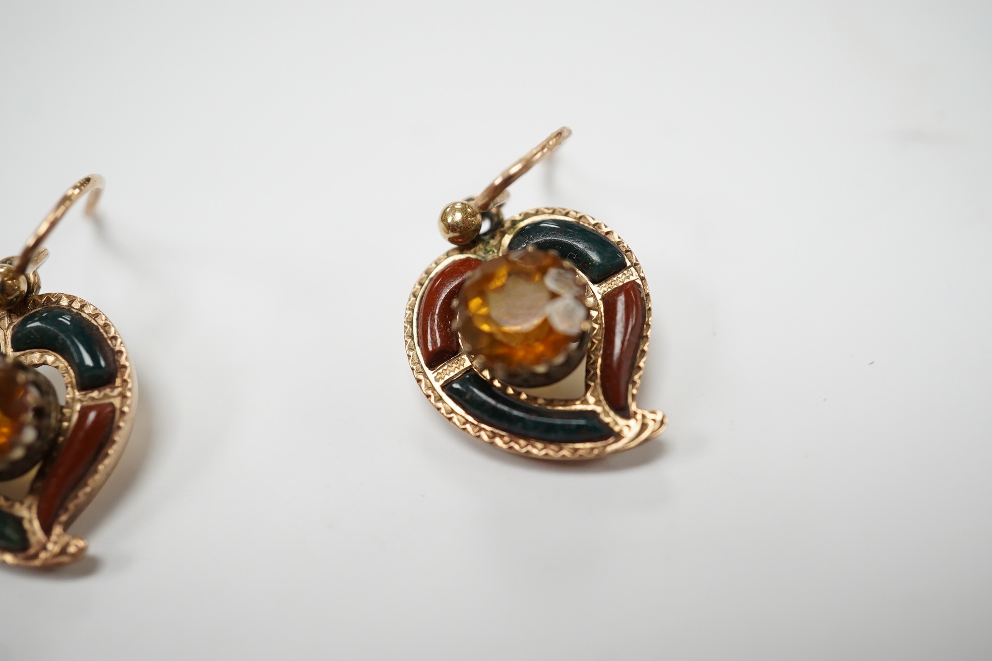 A yellow metal, Scottish hardstone and citrine set suite of jewellery, comprising a brooch, 30mm and pair of earrings, gross weight 7 grams. Condition - fair